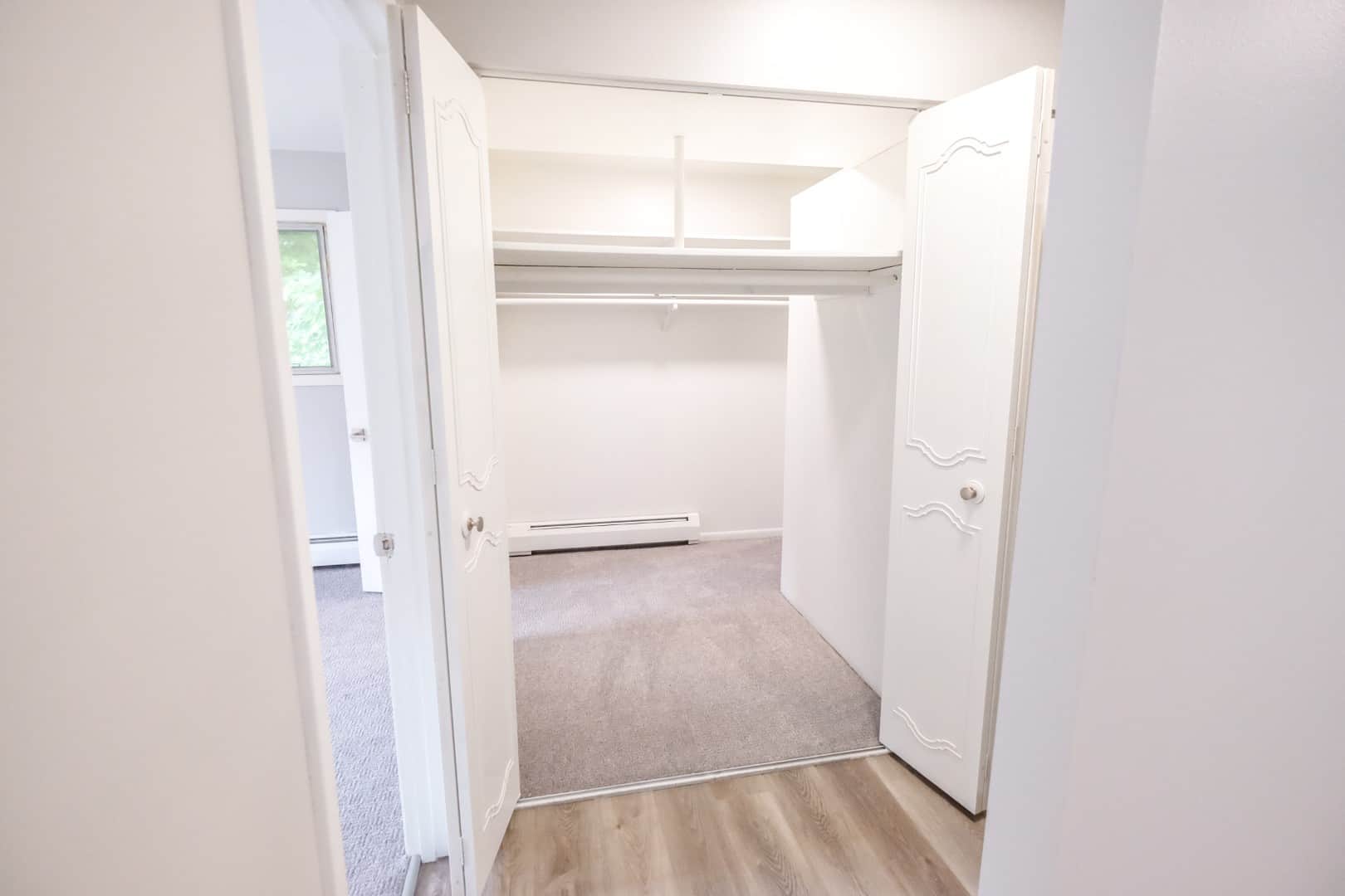 A large walk-in closet at The Concord offers ample storage space for residents. 