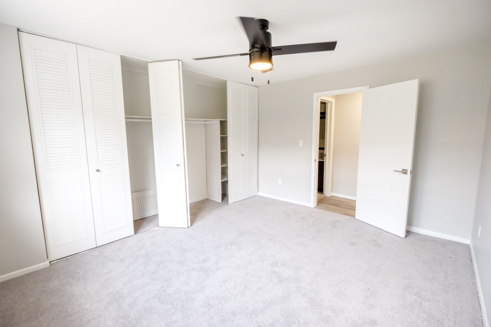 Residents enjoy organized storage with built-in closet shelves and cabinets. 
